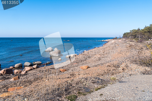 Image of Seashore with blue water and blue sky