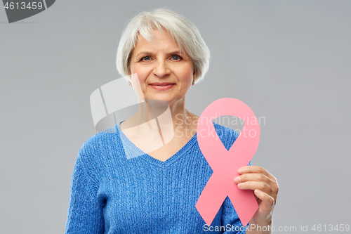 Image of old woman with pink breast cancer awareness ribbon