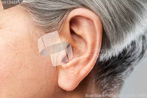 Image of close up of senior woman ear