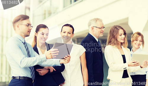 Image of business people with tablet pc computers at office