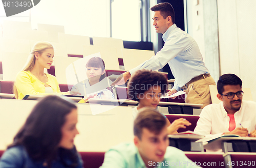 Image of teacher giving test to students on lecture