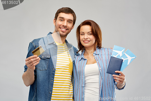 Image of couple with air tickets, passport and credit card