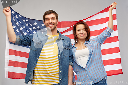 Image of couple holding flag of united states of america