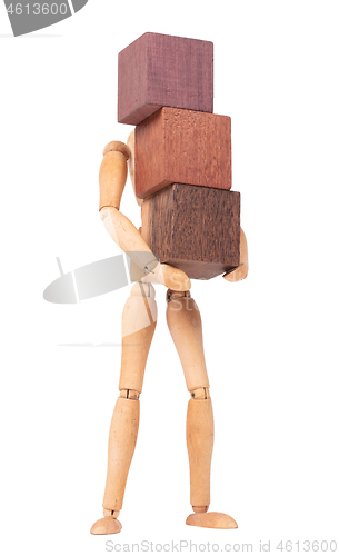Image of Wooden mannequin carrying wooden hardwood blocks