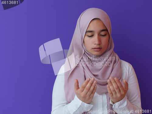 Image of female muslim praying with opend hands