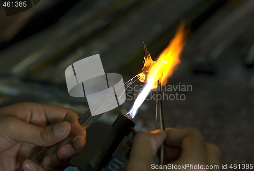 Image of Artist shaping glass