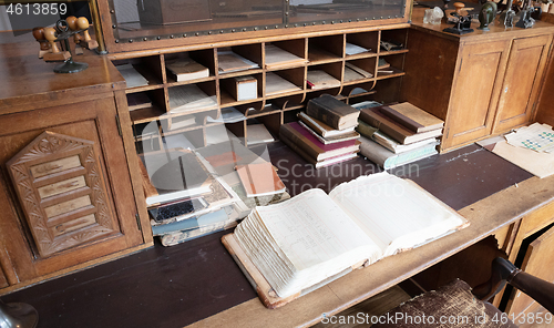 Image of Very old desk, full of old books and old paper