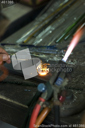 Image of Artist shaping glass