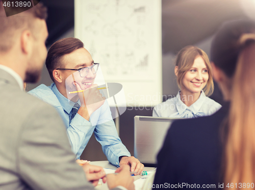 Image of architects with laptop meeting at office