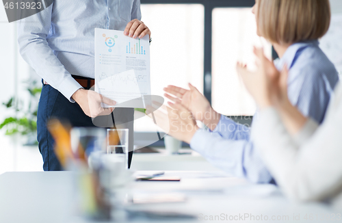 Image of business team at office meeting or presentation