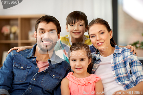 Image of portrait of happy family at home