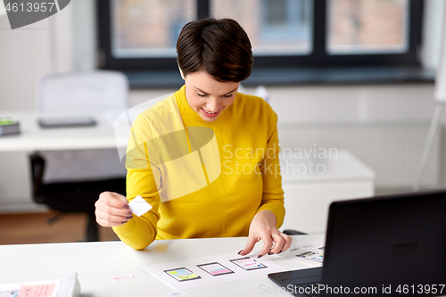 Image of ui designer working on user interface at office