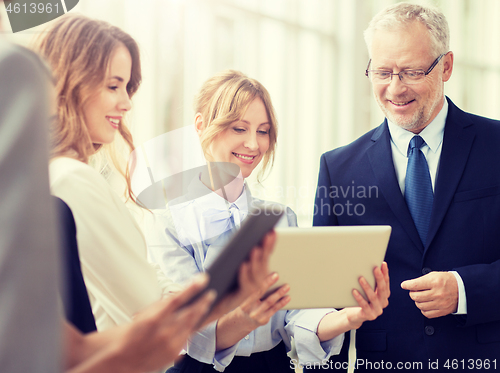 Image of business people with tablet pc computers at office