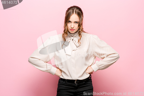 Image of The young emotional angry and scared woman standing and looking at camera