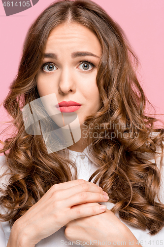 Image of Indoor shot of regretful woman looks gloomy and desperate