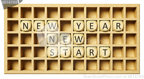 Image of a wooden grid with cubes new year new start