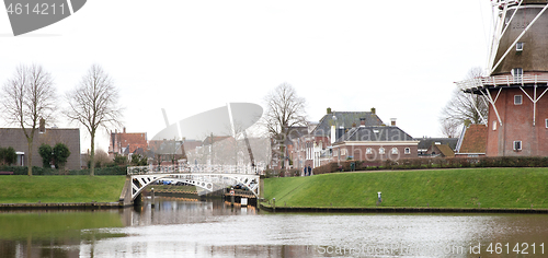 Image of Dokkum, the Netherlands on December 26, 2019: Canal and windmill