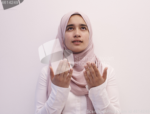 Image of female muslim praying with opend hands