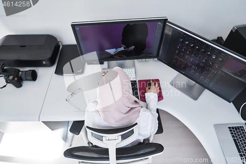 Image of Arabic creative professional  working at home office top view