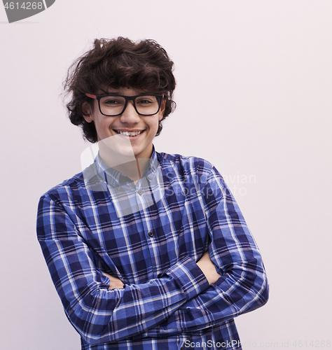 Image of portrait  of smart looking arab teenager with glasses