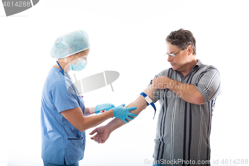 Image of Patient receives a blood test from nurse or pathologist