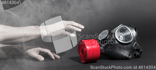 Image of Man in room filled with smoke, trying to reach for vintage gasma