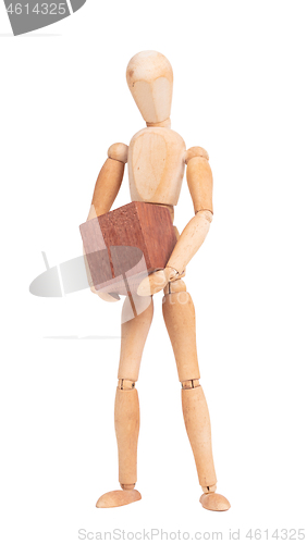 Image of Wooden mannequin carrying a wooden hardwood block