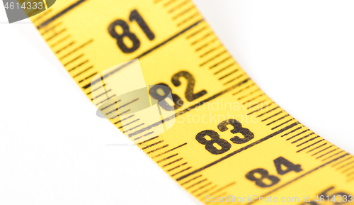 Image of Close-up of a yellow measuring tape isolated on white - 83