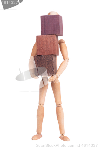 Image of Wooden mannequin carrying wooden hardwood blocks