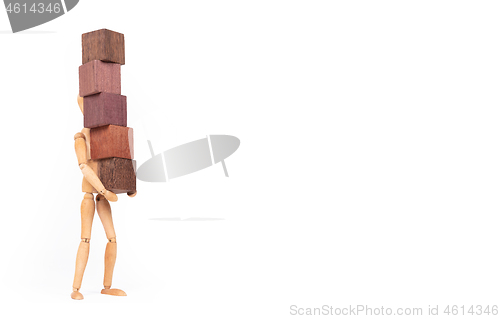 Image of Wooden mannequin carrying wooden hardwood blocks