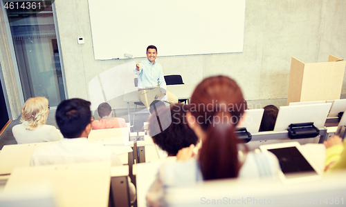 Image of group of students and teacher at lecture