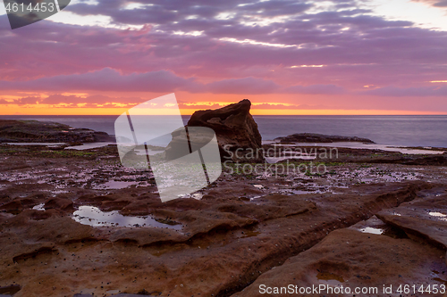 Image of Coastal sunrise skies on a rocky Sydney reef at low tide