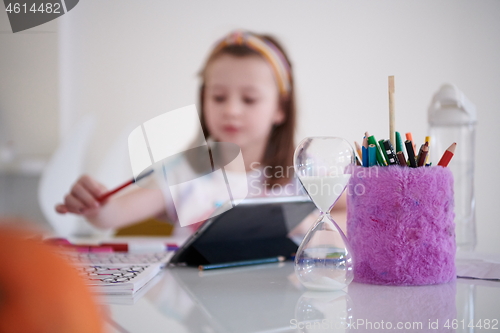 Image of Mother and little daughter  playing together  drawing creative a