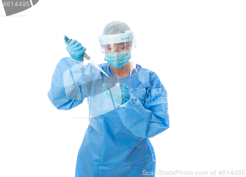 Image of Laboratory worker or pathologist in full PPE with pipette and pe