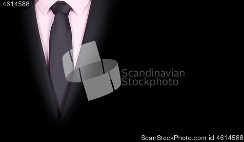Image of Man in a black suit, close-up