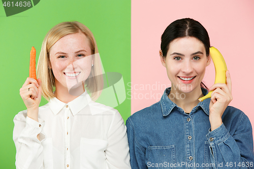 Image of Beautiful close-up portrait of young women with fruits and vegetables. Healthy food concept.