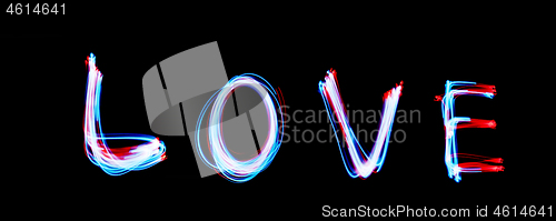 Image of Glowing inscription LOVE on a black background