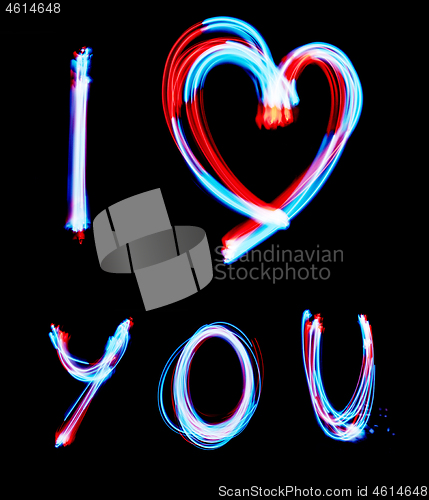 Image of Glowing inscription LOVE on a black background