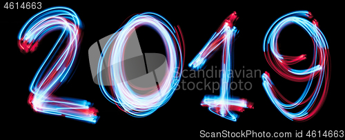 Image of 2019 happy new year number with neon lights backgrorund.