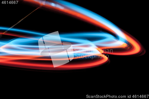 Image of multicolor led light painting round trails abstract background
