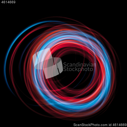 Image of multicolor led light painting round trails abstract background