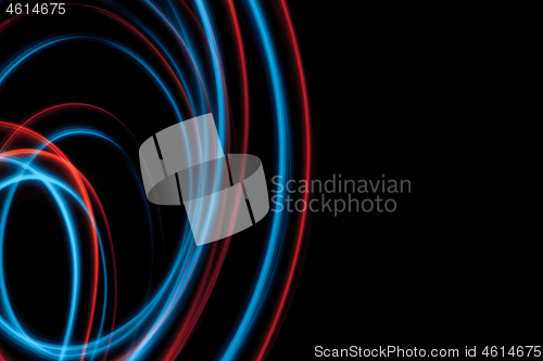 Image of multicolor led light painting round trails abstract background