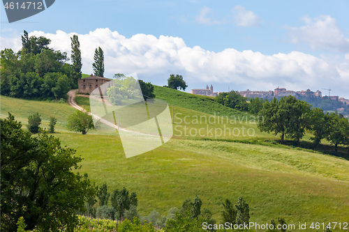 Image of Camerino in Italy Marche over colourful fields