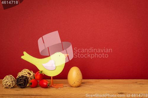 Image of bird with an egg easter holiday decoration background