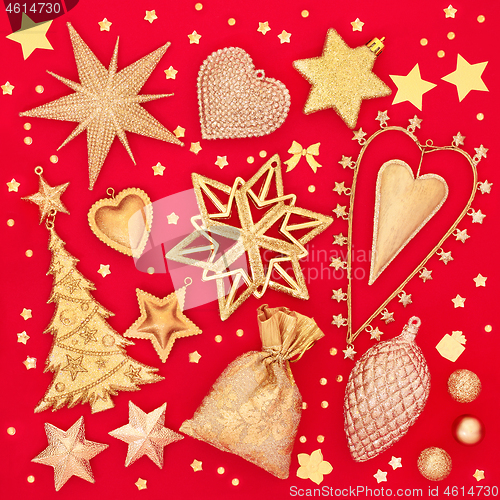 Image of Gold Christmas Tree Decorations On Red Background
