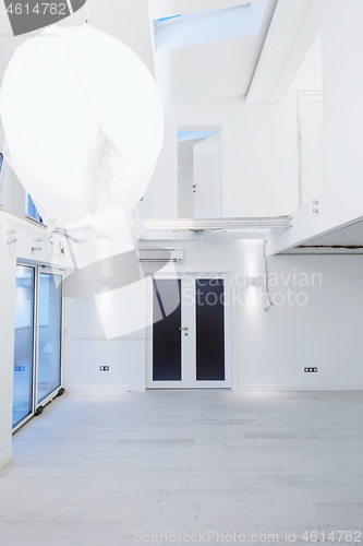 Image of Interior of empty stylish modern open space two level apartment