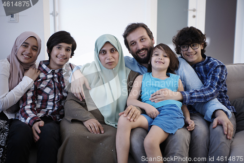 Image of muslim family portrait  at home