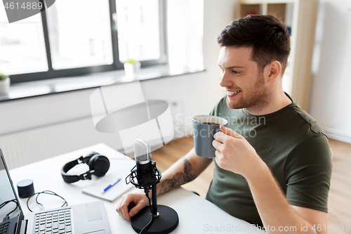 Image of blogger with laptop and microphone audio blogging