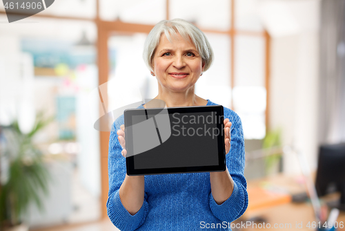 Image of senior woman using tablet computer