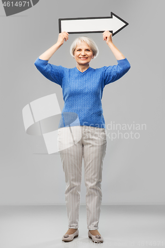 Image of smiling senior woman with big rightwards arrow